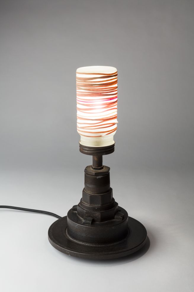 Lamp (assemblage of found iron car and machine parts, sand blasted kilner jar, elastic bands) by Fric and Frack. Photo: Plastiques Photography