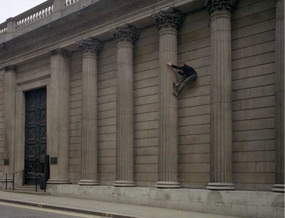 Image: man scaling Bank of England
