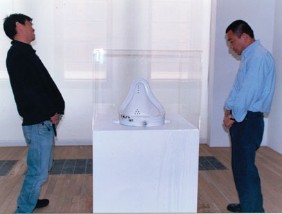 Photo: Two Artists Piss on Duchamp's Urinal